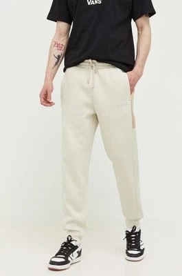 Zdjęcie produktu Nicce spodnie dresowe kolor beżowy z nadrukiem
