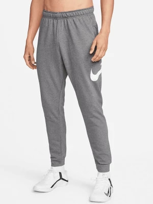 Zdjęcie produktu Nike Spodnie dresowe w kolorze szarym rozmiar: L