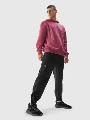 Zdjęcie produktu Spodnie casual joggery męskie - czarne 4F