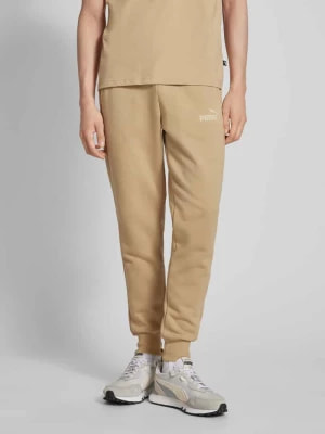 Zdjęcie produktu Spodnie dresowe o kroju regular fit z nadrukiem z logo PUMA PERFORMANCE