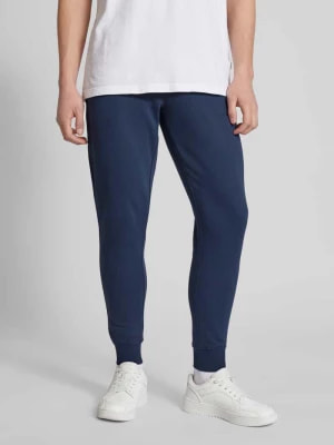 Zdjęcie produktu Spodnie dresowe o kroju slim fit z efektem melanżowym Tommy Jeans