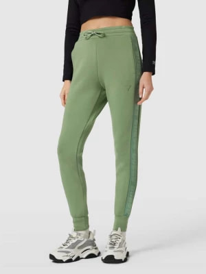 Zdjęcie produktu Spodnie dresowe z lampasami model ‘ALLIE’ Guess Activewear