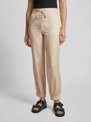 Zdjęcie produktu Spodnie materiałowe o kroju tapered fit z wiązanym paskiem Joop!