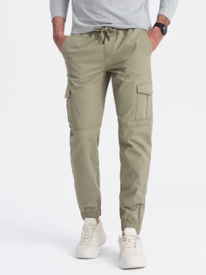 Zdjęcie produktu Spodnie męskie JOGGERY z zapinanymi kieszeniami cargo - khaki V1 OM-PAJO-0123
 -                                    XXL