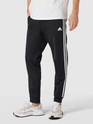 Zdjęcie produktu Spodnie sportowe o kroju regular fit z nadrukiem z logo ADIDAS SPORTSWEAR