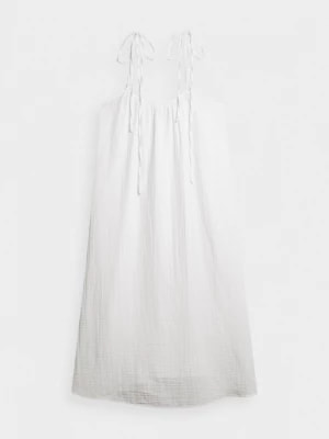 Zdjęcie produktu Sukienka z bawełnianego muślinu maxi - kremowa OUTHORN