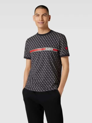 Zdjęcie produktu T-shirt z logo na całej powierzchni model ‘JAMEY’ Guess Activewear