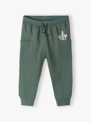 Zdjęcie produktu Zielone bawełniane spodnie dresowe niemowlęce z kieszonkami 5.10.15.